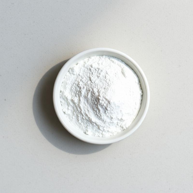 Macro photograph of fine white magnesium glycinate powder in a porcelain dish on pale stone